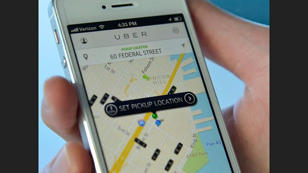 Uber app on a phone setting a pickup location